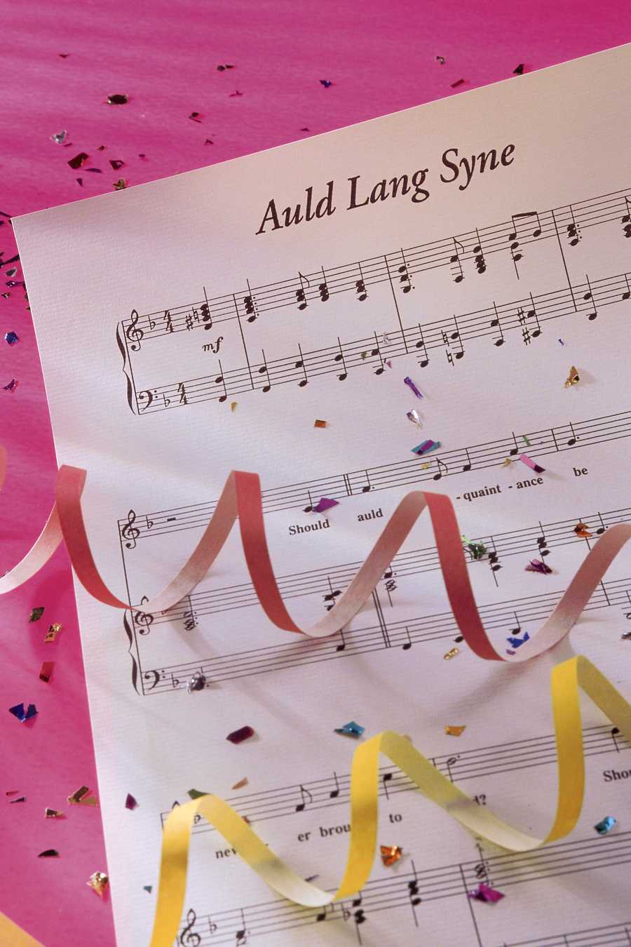 Auld Lang Syne sheet music with streamers and confetti Auld Lang Syne sheet music with streamers and confetti