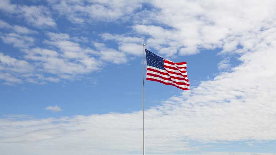 usa, montana empty parking lot big american flag
