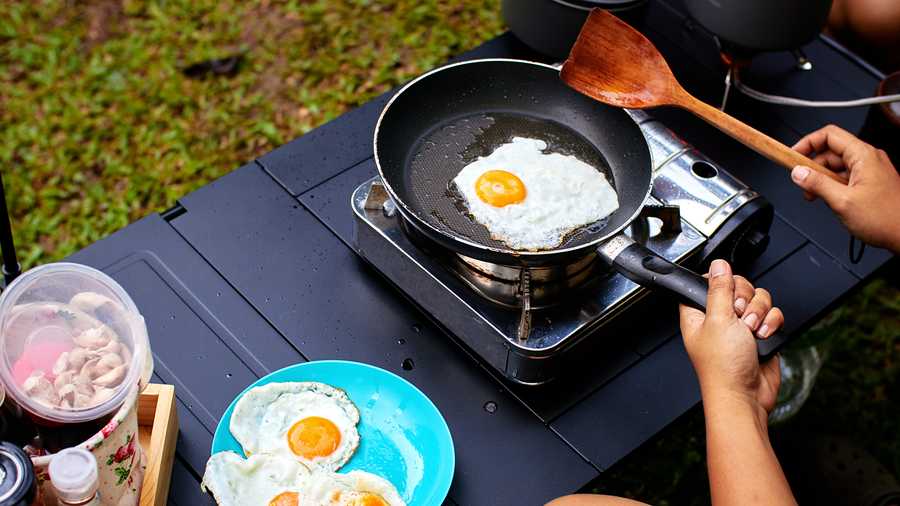 cooking eggs on camping kitchen