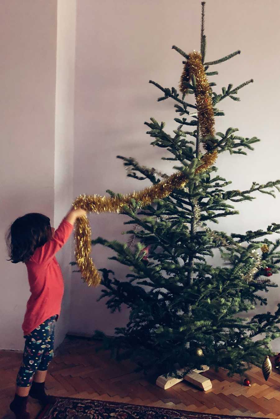 Children Decorating Christmas Tree At Home Children Decorating Christmas Tree At Home