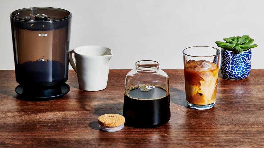 OXO cold brew maker with glass of iced coffee