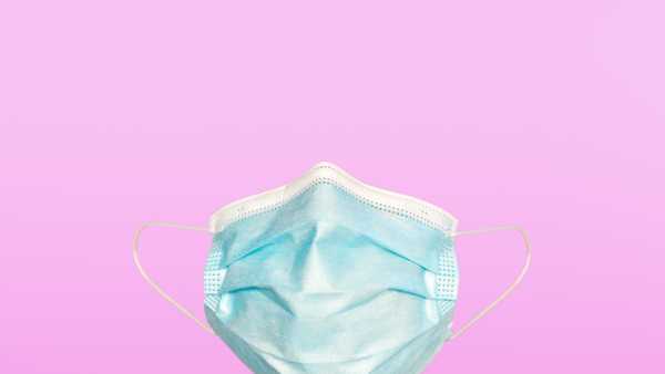 what is flurona, covid19 face mask on color background