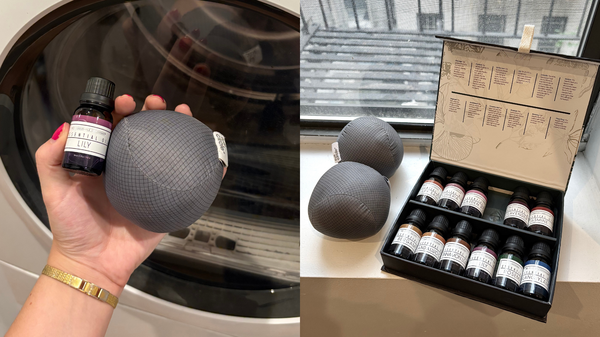 hand holding dryer ball and lily essential oil bottle two dryer balls and essential oil kit