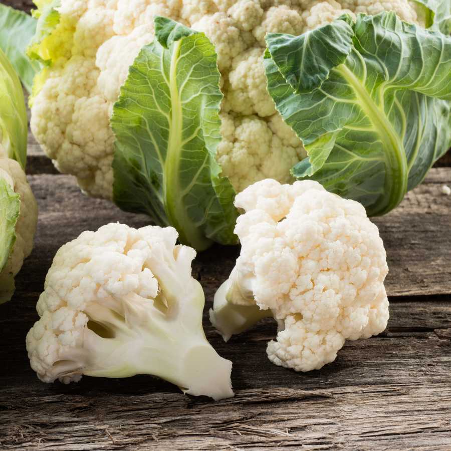Organic cauliflower on wooden background Organic cauliflower on wooden background