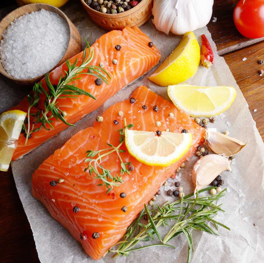 Raw salmon on baking paper Raw salmon on baking paper