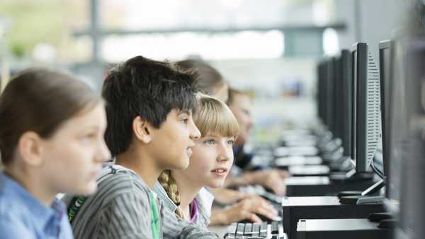 Students using computers in classroom