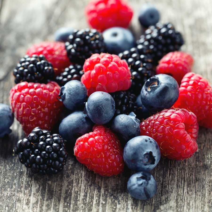 summer berries on wooden surface summer berries on wooden surface
