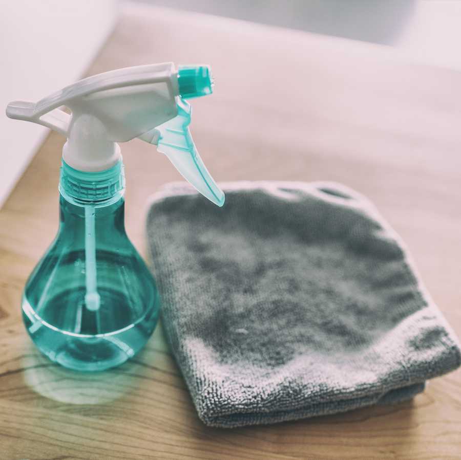 surface cleaning home kitchen all purpose cleaner disinfectant spray bottle with towel to clean high touch surfaces from covid 19 virus contagion