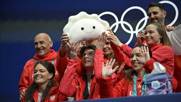 poland's vladimir samoilov bottom row, c gestures in the kiss and cry area after competing in the figure skating team event men's singles short program during the milano cortina 2026 winter olympic games at milano ice skating arena in milan on february 7, 2026 photo by wang zhao  afp via getty images