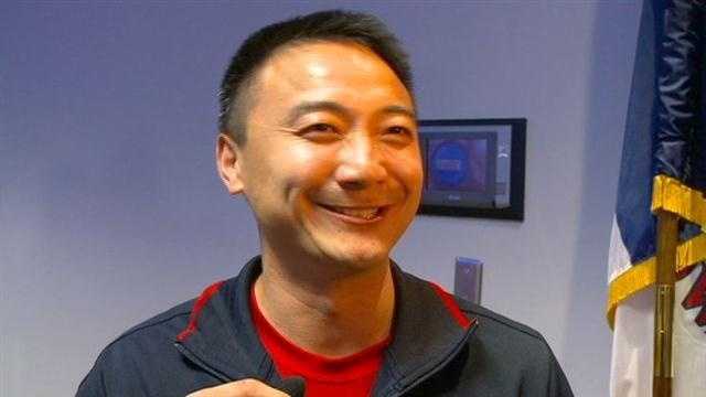 Iowa Olympics coach Liang Chow returned home to Des Moines Wednesday afternoon.