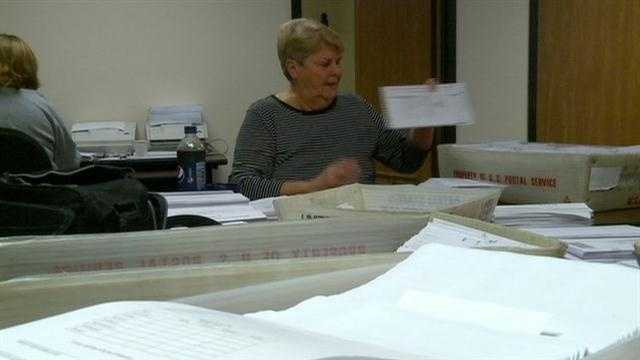 KCCIs Laura Nichols checks on early voting ballot numbers.