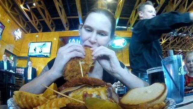 A Nebraska woman eats a 4-pound sandwich and 1 pound of fries in 7:53.  It's the Emmenecker Challenge at Jethro's restaurant.