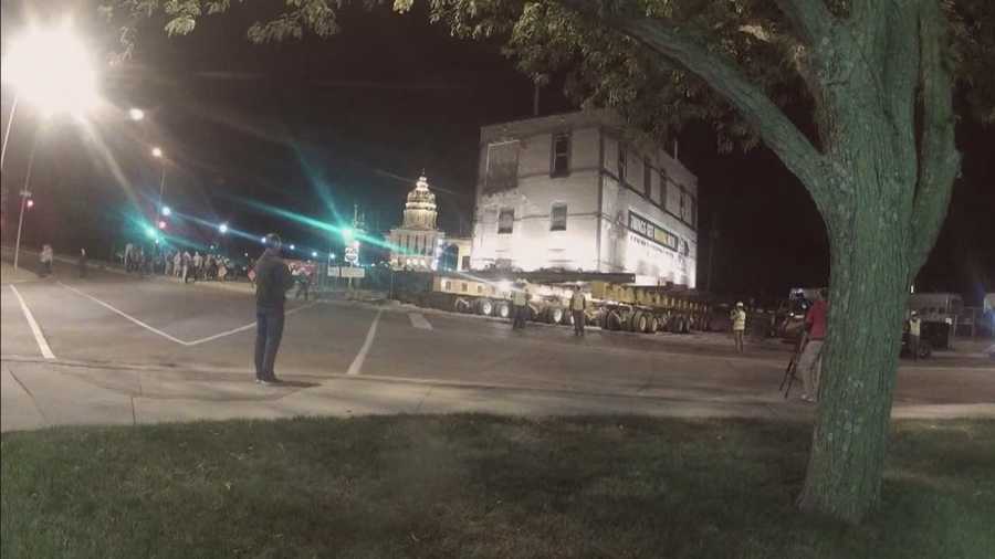 Dozens of people stayed up late to watch a Des Moines landmark move to a new location.
