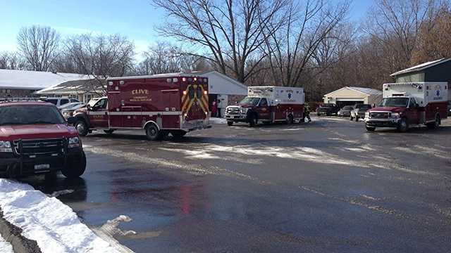 Ambulances evacuate residents after sprinkler pipe bursts.