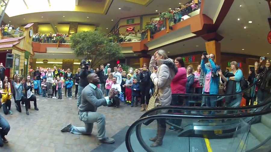 Sean Ratliff proposed to his girlfriend, Lindsey Baker, with a flash mob of more than 100 people at the Valley West Mall in West Des Moines.