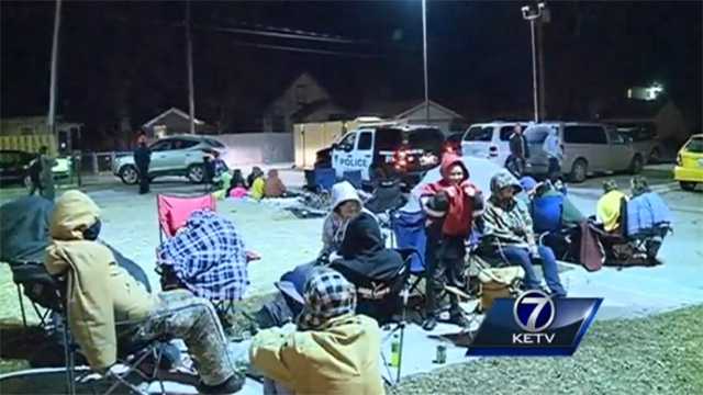 People camp outside a new Krispy Kreme store in Iowa to get a free doughnut deal.