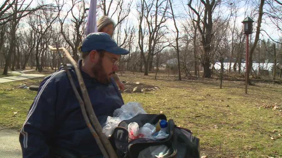 An Iowa man travels a popular bike trail picking up trash and spreading cheer.