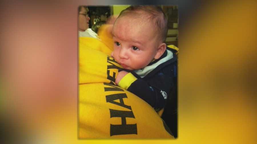 A teenage father was in police custody Wednesday and charged with neglect in connection with the death of a 4-month-old boy.