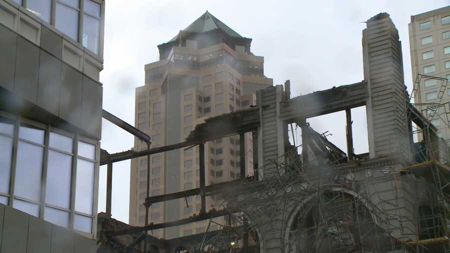 Rain and falling glass have delayed the demolition of the Younkers building’s remains downtown.