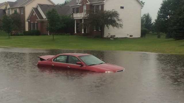 Cars trapped in flash flooding in Clive