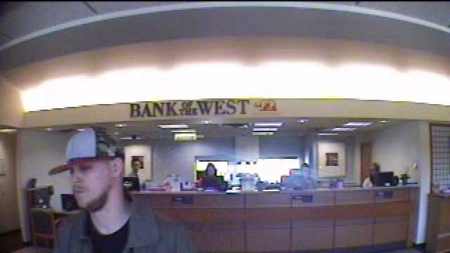 Photos released by police of a bank robbery in Des Moines.
