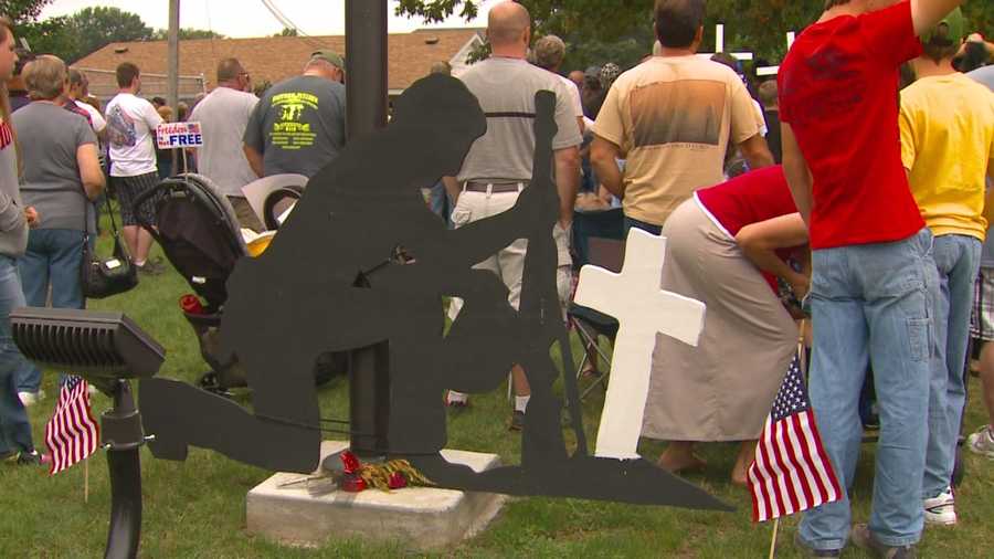A group of supporters of a landmark honoring veterans attended a rally at Young's Park in Knoxville to protest its removal.