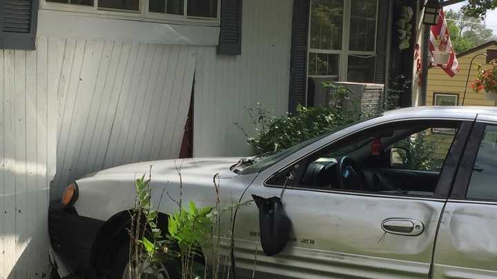 PHOTOS: Car crashes into Des Moines home