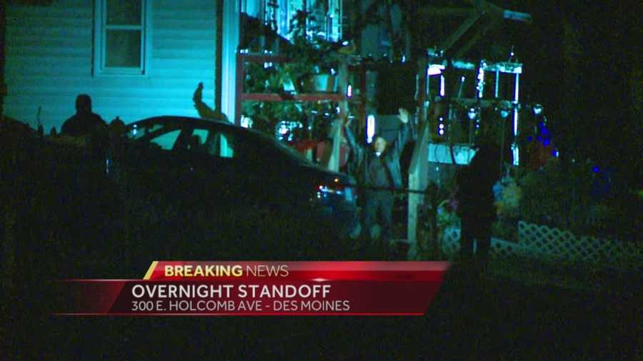 An overnight standoff in Des Moines ended after the suspect surrendered.
