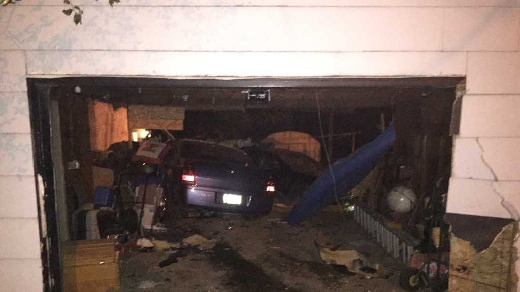 PHOTOS: Police chase ends with car in garage