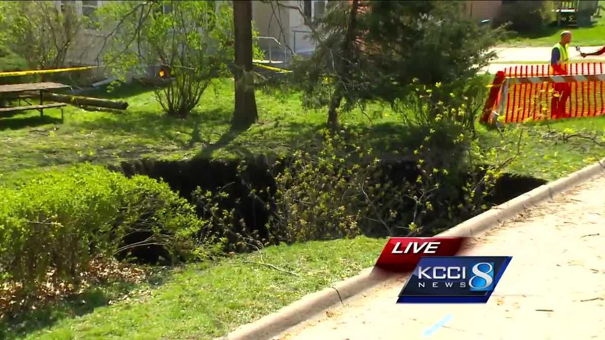 PHOTOS Deep sinkhole develops in Iowan's front yard