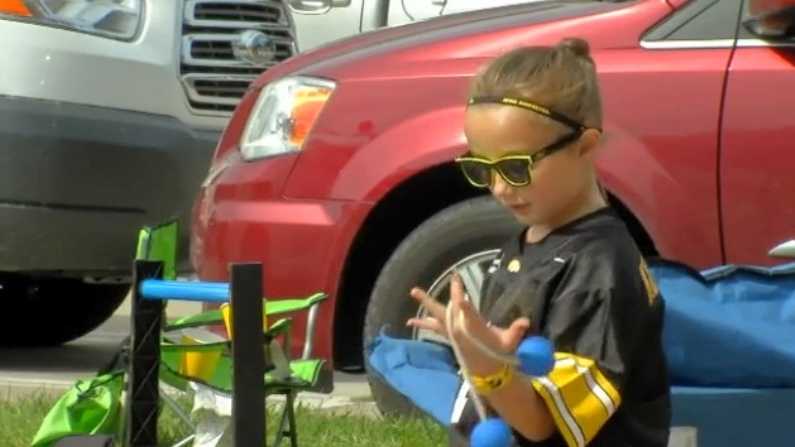 The first 2016 Kid Captain joins Hawkeye players on field