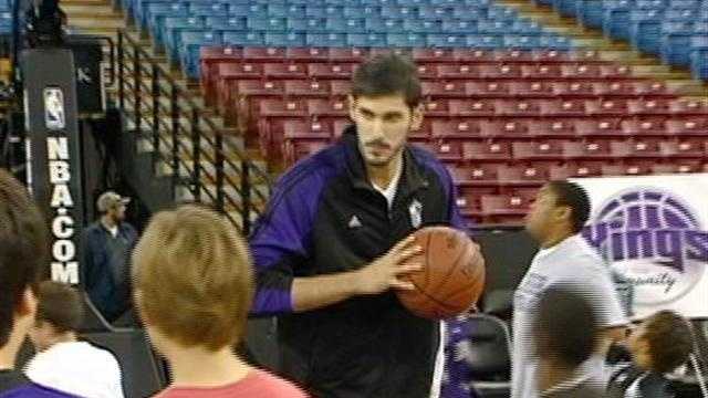 Kings player Omri Casspi shoots hoops with local kids as a part of the Kings in the Community program.