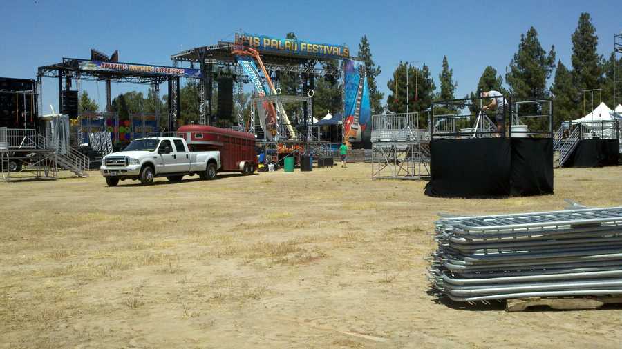 Crews assemble a stage for the Palau festival.