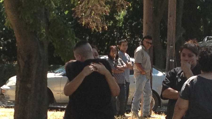 Family members grieve after learning of the shooting. 