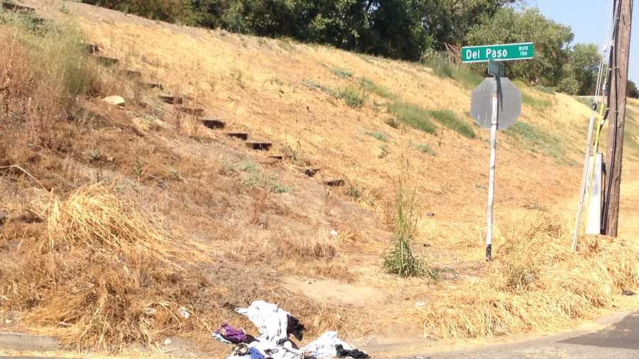 Some clothes and other items left behind by homeless are visible to drivers on Del Paso Boulevard. 
