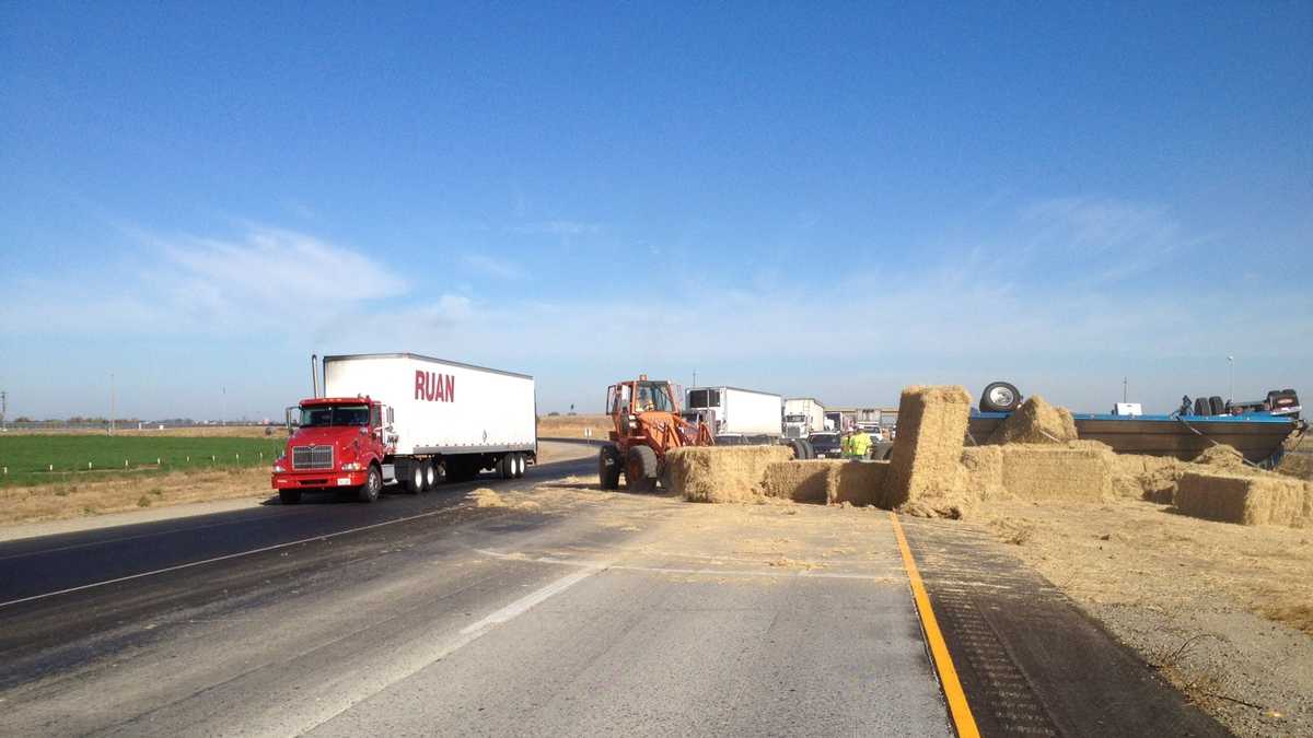 Photos: Overturned big rig leaves hay on I-5, affecting traffic