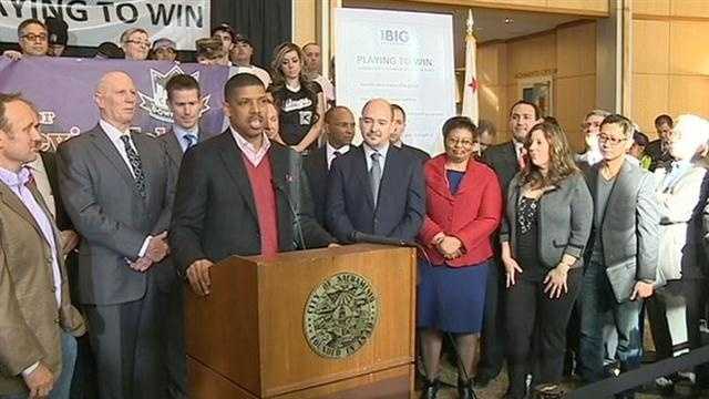 Sacramento Mayor Kevin Johnson appears with a group of local investors at city hall on Jan 23.