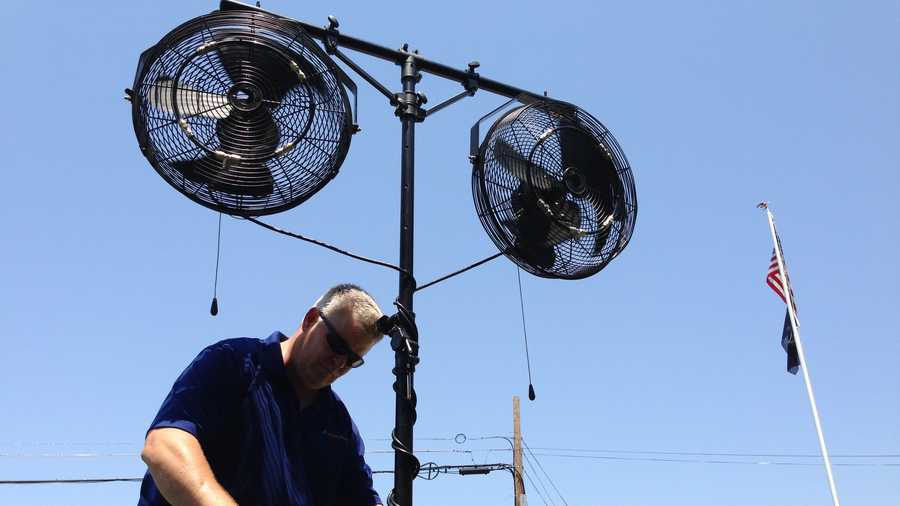 Dave Paul of Misting Pros shows one of the mist-producing fans that he rents.