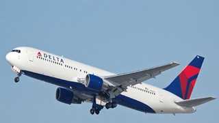A Delta spokesman said the plane was at the gate when the tug accidentally hit the nose gear.
