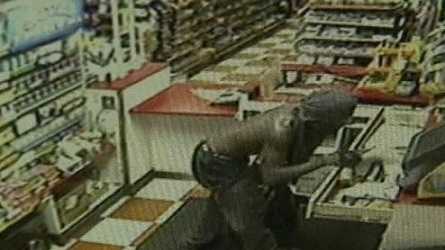 Surveillance video shows a man taking a cash register just after 4 a.m. Wednesday .