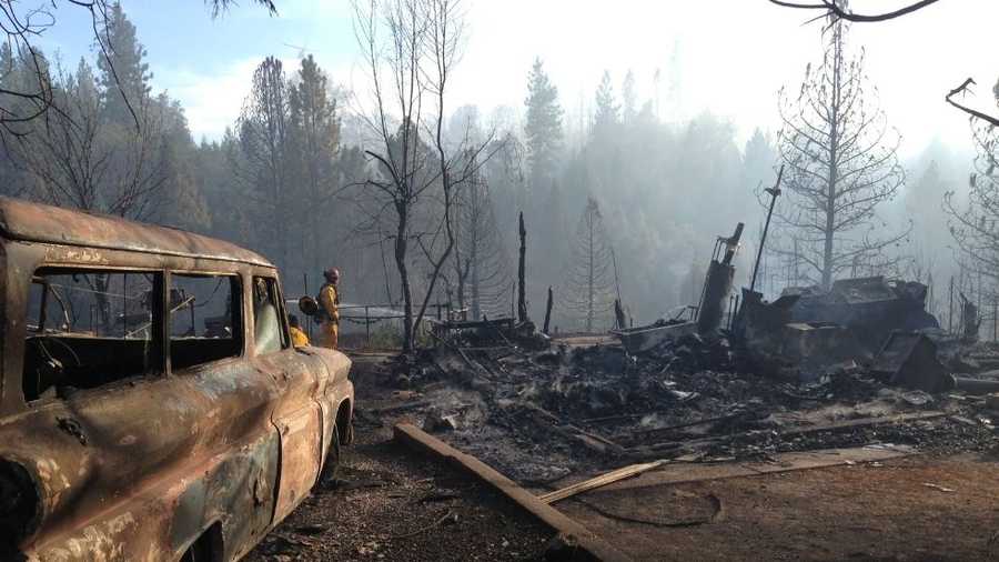 Wildfire destroys at least one home in