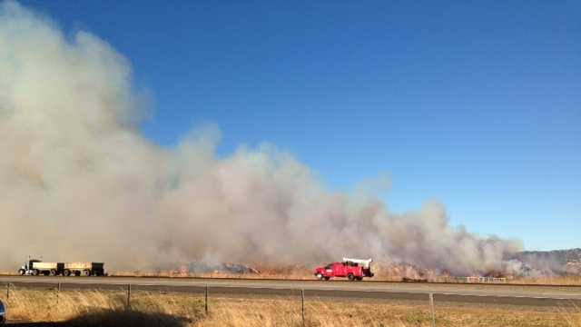 Massive hay fire lights up sky, sends smoke over I-505