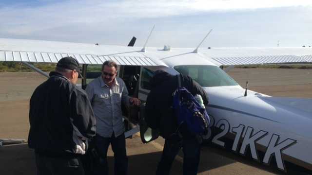 Friends of Stephen Pease board a plane at Little River Airport (Nov. 14, 2013).