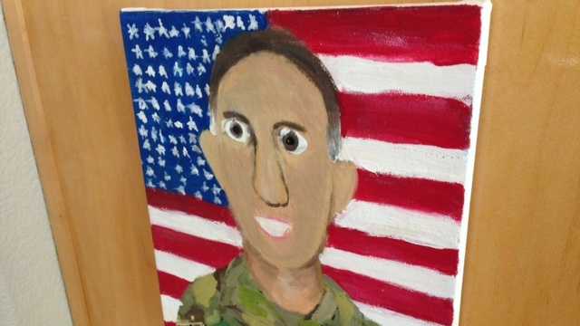 A portrait of a Placer County dad deployed in Afghanistan hangs near the Aaron family's kitchen.