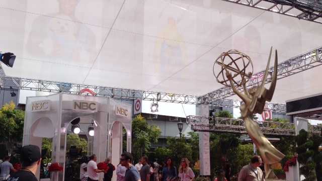 Crews prepare the red carpet at the 2014 Primetime Emmy Awards.
