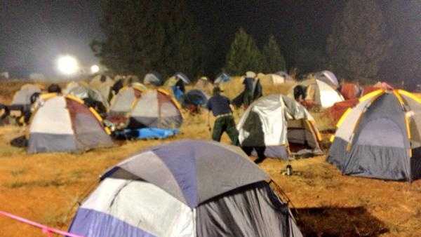 Crews stake their own tent camping areas. The camp area is bright and noisy, making it tough to get sleep.