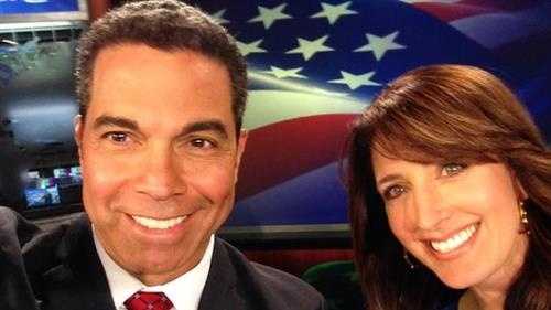 KCRA 3's Gulstan Dart and Edie Lambert take an election selfie as they anchor coverage in the studio with an American flag backdrop. (Nov. 4, 2014)