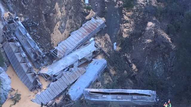 A train with 12 railroad cars filled with grains derailed Tuesday morning near Highway 70 in Plumas County. (Nov. 25, 2014)