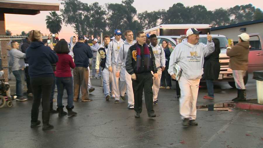 Central Catholic players and coaches loaded onto buses headed for Southern California early Thursday morning ahead of their CIF state championship game against St. Margaret's High School. (Dec. 18, 2014)