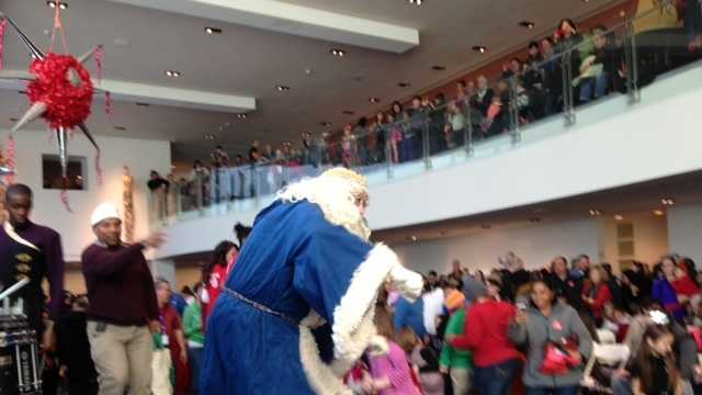 Father Time celebrates with families at the Crocker Art Museum's New Year's Eve festival.